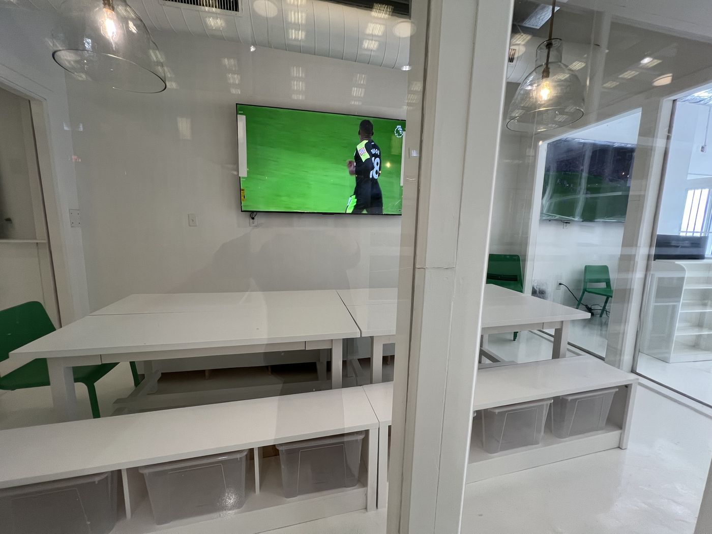 Event room with tables and a big TV